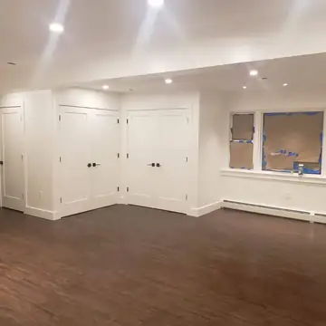 Dark vinyl plank installed in a finished basement, Rockland County NY